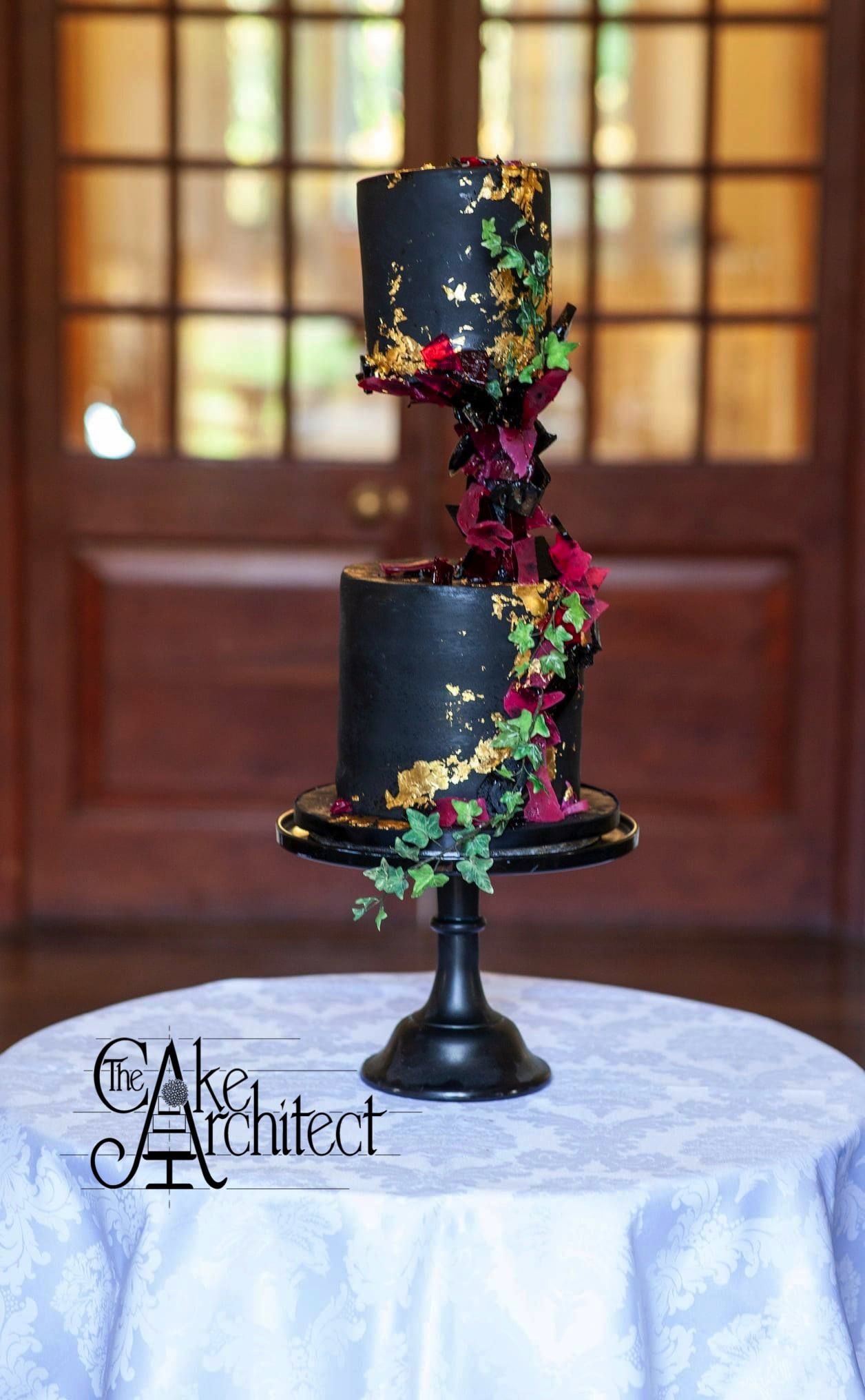 Sculpted Geode alternative black, gold and wine wedding cake set up at Clearwell Castle in the Forest of Dean