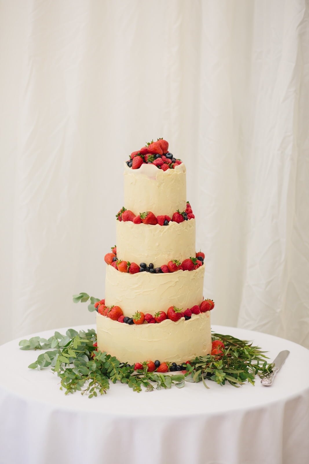 White chocolate wrapped 4 tier wedding cake at Bath Botanical Gardens